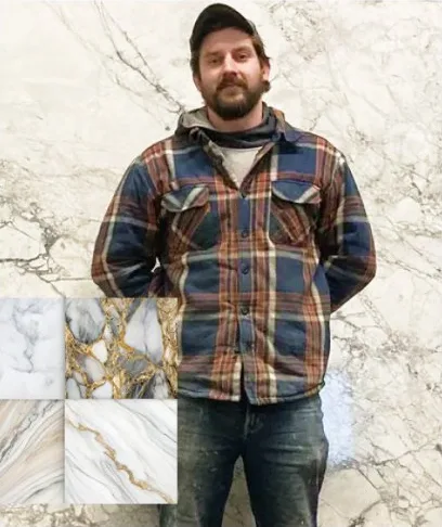 Mark Strauss, founder of Prime Stone and Tile, in front of a stone slab
